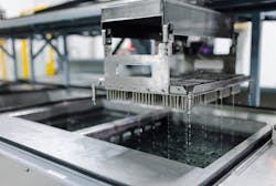 A gantry moves trays of product through various baths before and after machining. (&copy; Beckhoff, 2024)