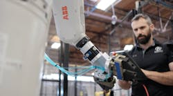 A user programs an ABB robot using the ForgeOS interface.